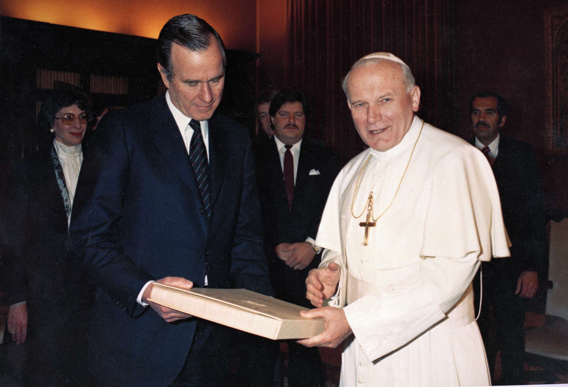 Pope John Paul II hands U.S. Vice President George Bush a book during their meeting in Vatican City, Feb. 15, 1984. 

In 1984, the United States and the Vatican established full diplomatic relations for the first time in more than a century. (AP Photo/Arturo Mari)