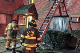 Firefighters found an apartment with hoarding conditions on fire on the second floor — and rescued a man by ladder from the window. (Courtesy D.C. Fire and EMS)
