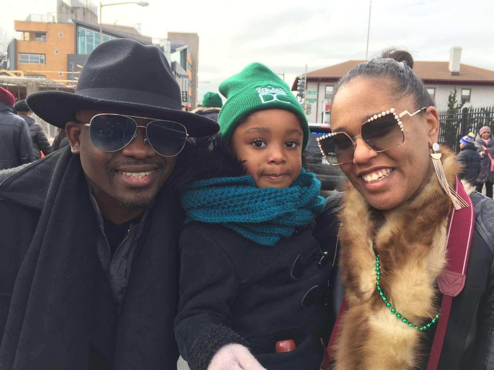 The Osuchukwu family smiles for a photo at the MLK Peace Walk and Parade. (WTOP/Kristi King)