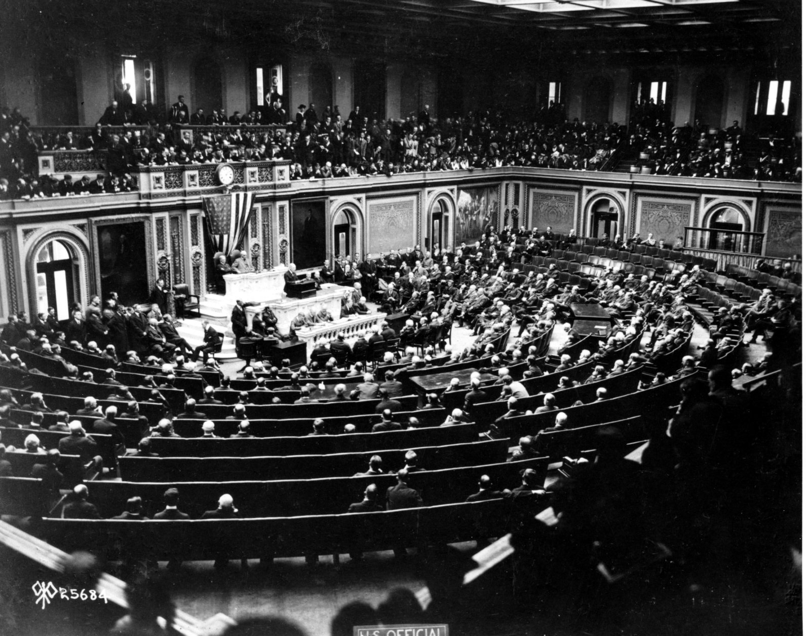 U.S. President Woodrow Wilson reads the terms of the German Armistice to Congress in Joint session, and announces the end of World War I, in Washington, D.C., on Nov. 11, 1918. The peace plans proposals are outlined in the 'fourteen points.' (AP Photo)