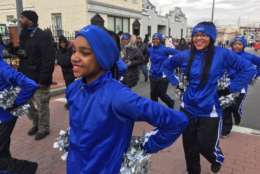A squad of cheerleaders do as cheerleaders do at the MLK Peace Walk and Parade. (WTOP/Kristi King)