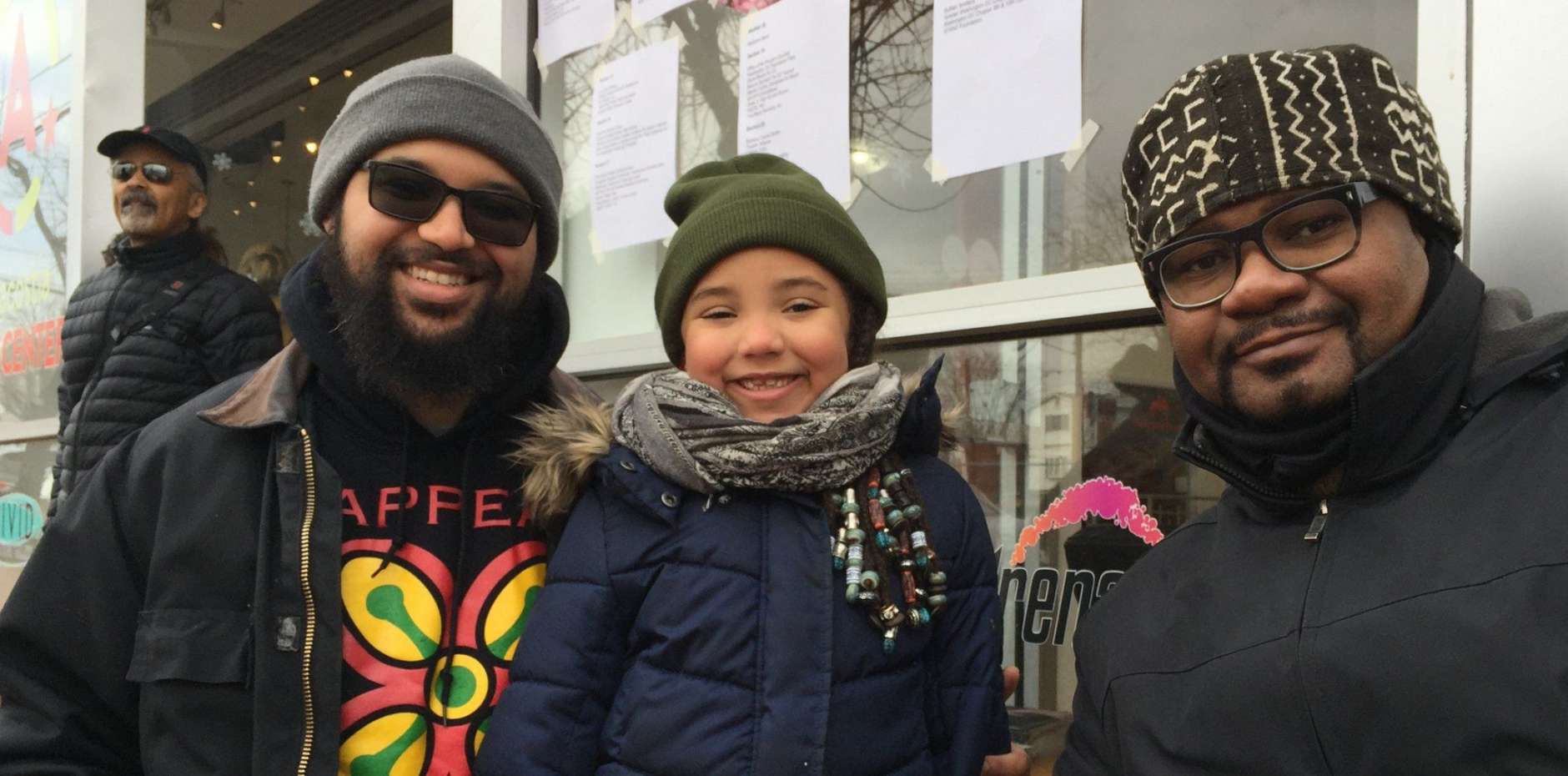Mike Bolds, Ife Bolds Jacob, Emile Smith at the MLK Peace Walk and Parade. Ife Jacob, 5, said, "His dream was that everybody was treated fairly and that segregation would stop and that people wouldn't be hurt by the color of their skin." (WTOP/Kristi King)