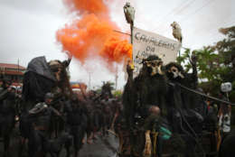 Revelers perform during the 'Bloco da Lama', or Mud Block carnival group parade in Paraty, Brazil, Saturday, March 5,  2011. Brazil's official carnival is held this year March 4-8. (AP Photo/Rodrigo Abd)