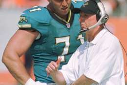 Jacksonville Jaguars tackle Tony Boselli (71) talks with coach Tom Coughlin on the sidelines during the Jaguars' 27-7 win over the Cleveland Browns in Cleveland, Sunday, Sept. 3, 2000. (AP Photo/Phil Long)