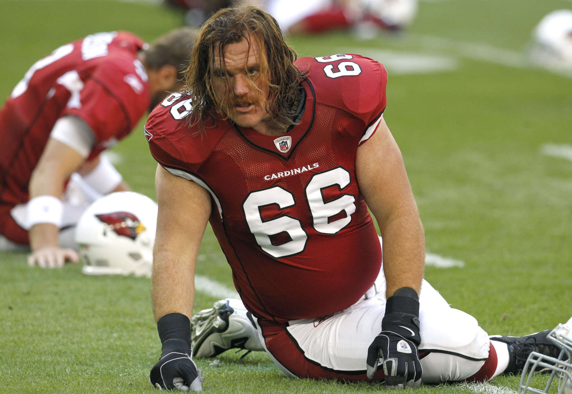Arizona Cardinals' Alan Faneca (66) stretches prior to an NFL football game against the St. Louis Rams Sunday, Dec. 5, 2010, in Glendale, Ariz.  The Rams defeated the Cardinals 19-6. (AP Photo/Ross D. Franklin)