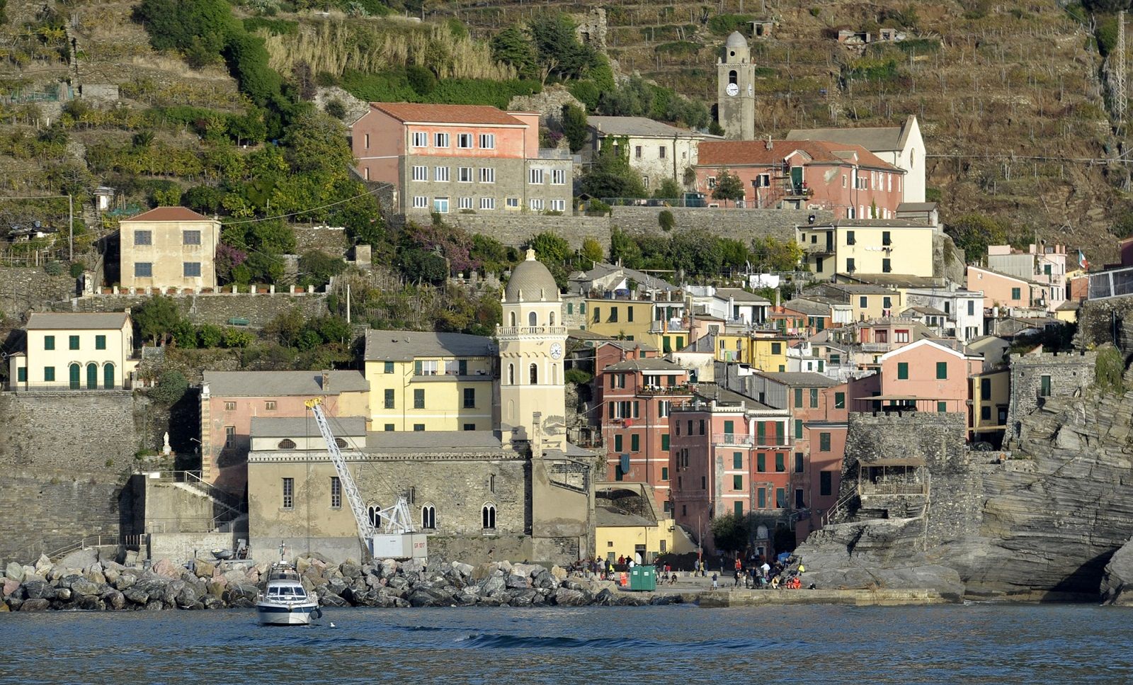 A view of the small town of Vernazza, northern Italy, along the Cinque Terre hiking trail popular for its breathtaking views, taken from the Mediterranean sea Friday, Oct. 28, 2011. Flash floods and mudslides triggered by heavy rains earlier this week barreled through picturesque towns along the northwest coast, burying streets under mud, damaging homes, stores, churches and overturning vehicles. At least nine people died. Among hard-hit towns are Monterosso and Vernazza, along the Cinque Terre hiking trail popular for its breathtaking views. (AP Photo/Marco Vasini)