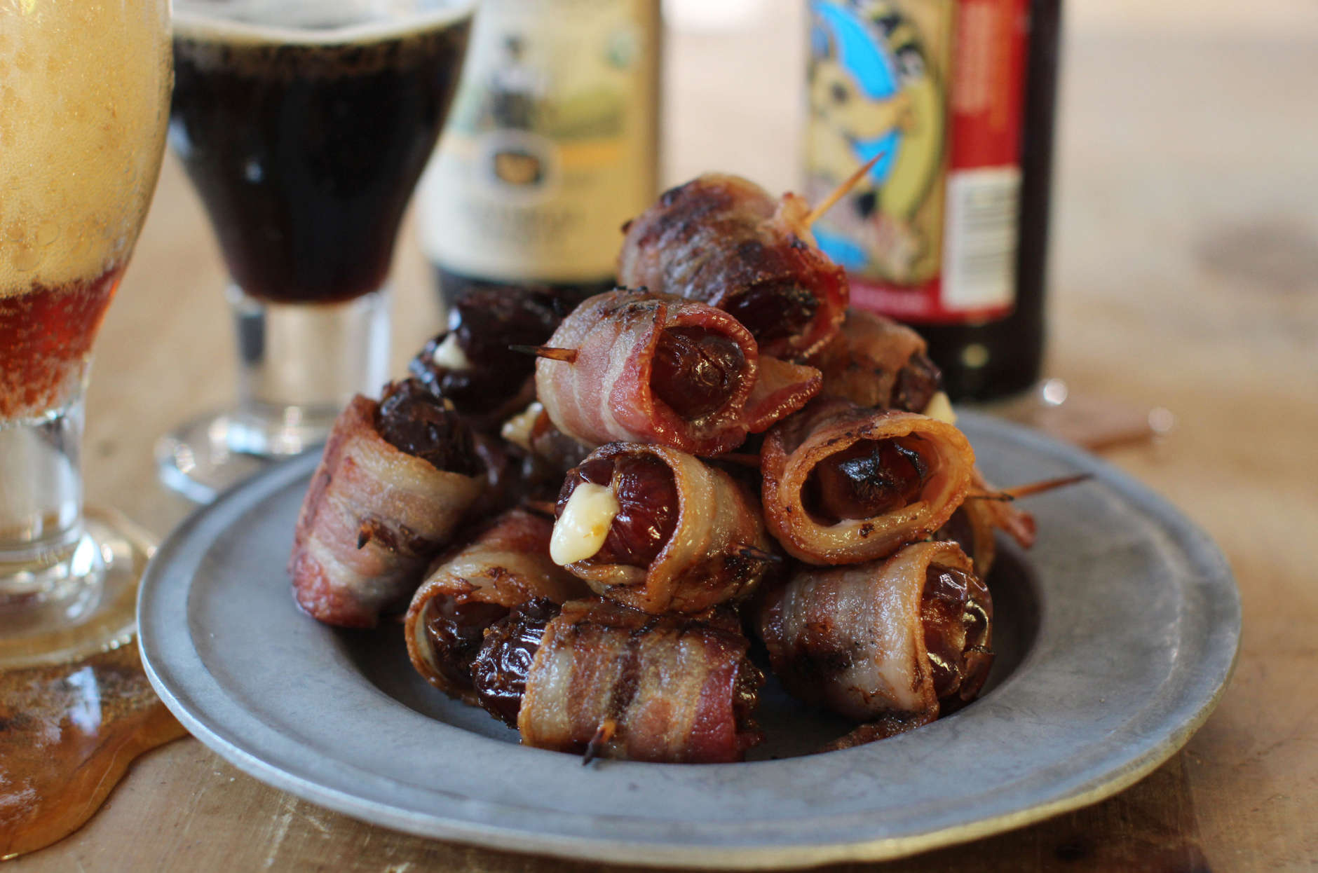 This Nov. 2, 2015 photo shows bacon wrapped Parmesan stuffed dates in Concord, N.H. The dates are easy to make, and even easier to eat. (AP Photo/Matthew Mead)