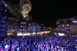 FILE - In this Feb. 2, 2015, file photo, fireworks explode during the opening ceremony for the FIS Alpine World Ski Championships, in Vail, Colo. Vail Resorts, which is the largest resort operator in North America, is buying the continent's biggest ski area, Canada's Whistler, the site of the 2010 Winter Olympics. Vail Resorts Inc. announced Monday, Aug. 8, 2016, that it was purchasing Whistler Blackcomb Holdings Inc., the Canadian ski resort company, for $1.06 billion, adding to its aggressive expansion. (AP Photo/Brennan Linsley, File)