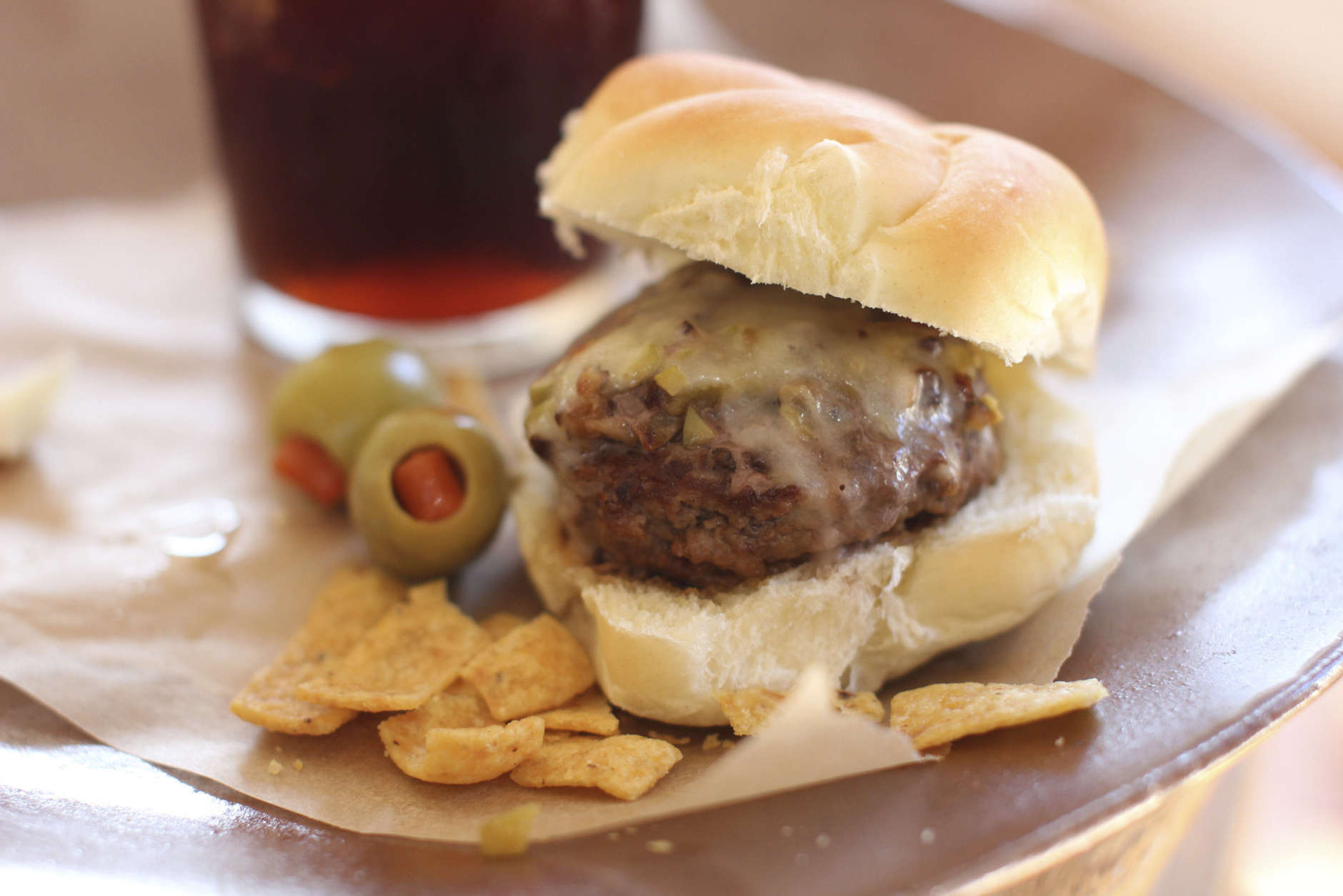 FILE-This Nov. 16, 2015 photo shows beer steamed cheese and mushroom beef sliders in Concord, N.H. This dish is from a recipe by Sara Moulton. (AP Photo/Matthew Mead)