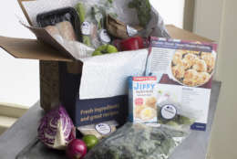 FILE - In this Oct. 6, 2014 file photo, an example of a home delivered meal from Blue Apron seen in Concord, N.H. Despite the old saying, you can buy happiness, especially if you spend it to save yourself time, new research finds.Researchers surveyed more than 6,000 people in four countries and found that people who doled out cash to save them time, housekeeping, grocery delivery services, taxis, were happier than those who don’t.  (AP Photo/Matthew Mead, File)