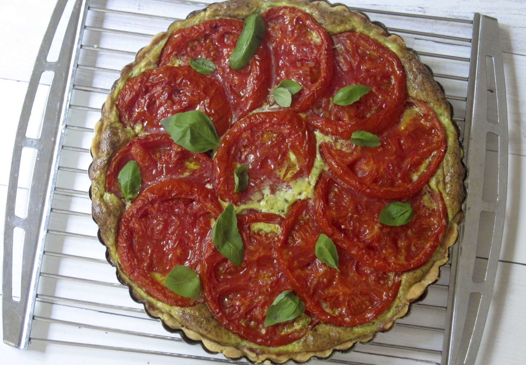 This July 26, 2017 photo shows a tomato, mozzarella and basil tart in New York. This dish is from a recipe by Sara Moulton. (Sara Moulton via AP)