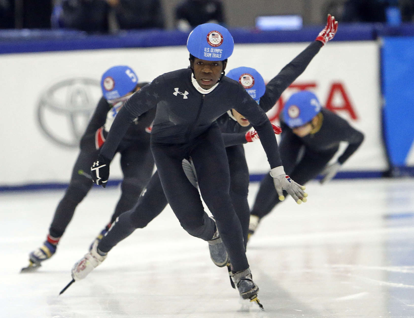 Maame Biney, center, races to finish during the women's 500-meter final A during the U.S. Olympic short track speedskating trials Saturday, Dec. 16, 2017, in Kearns, Utah. (AP Photo/Rick Bowmer)