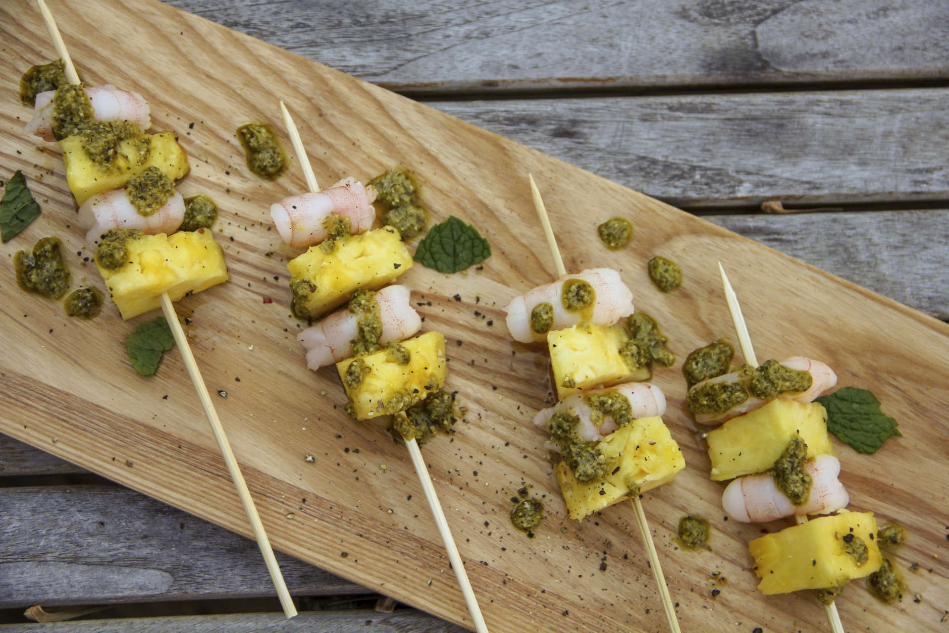 This Dec. 26, 2017 photo shows shrimp and pineapple skewers in Bethesda, Md. A super easy go-to recipe, which uses easy pantry ingredients, you can even use canned pineapple, to create something that still feels high-end. (Melissa daArabian via AP)