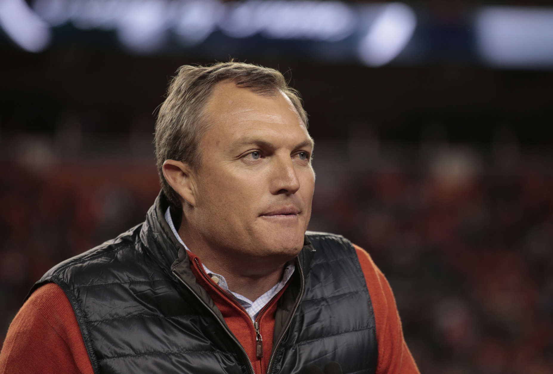 Former Denver Broncos' John Lynch speaks after being inducted into the Broncos ring of honor at half time of an NFL football game against the Houston Texans, Monday, Oct. 24, 2016, in Denver. (AP Photo/Joe Mahoney)