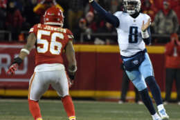 Tennessee Titans quarterback Marcus Mariota (8) throws in front of Kansas City Chiefs linebacker Derrick Johnson (56) during the second half of an NFL wild-card playoff football game, in Kansas City, Mo., Saturday, Jan. 6, 2018. (AP Photo/Ed Zurga)