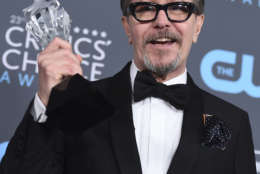 Gary Oldman poses in the press room with the award for best actor - film for "The Darkest Hour" at the 23rd annual Critics' Choice Awards at the Barker Hangar on Thursday, Jan. 11, 2018, in Santa Monica, Calif. (Photo by Jordan Strauss/Invision/AP)