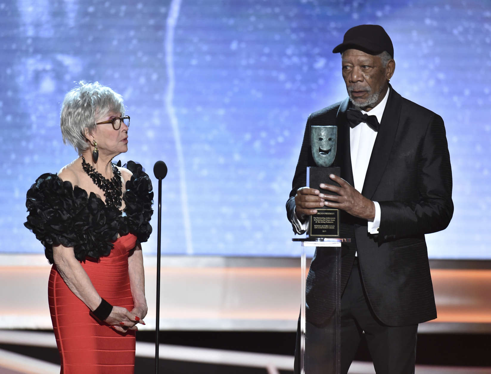 Rita Moreno, left, looks on as Morgan Freeman accepts the Life Achievement Award at the 24th annual Screen Actors Guild Awards at the Shrine Auditorium &amp; Expo Hall on Sunday, Jan. 21, 2018, in Los Angeles. (Photo by Vince Bucci/Invision/AP)