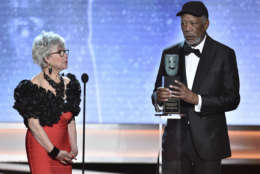 Rita Moreno, left, looks on as Morgan Freeman accepts the Life Achievement Award at the 24th annual Screen Actors Guild Awards at the Shrine Auditorium &amp; Expo Hall on Sunday, Jan. 21, 2018, in Los Angeles. (Photo by Vince Bucci/Invision/AP)