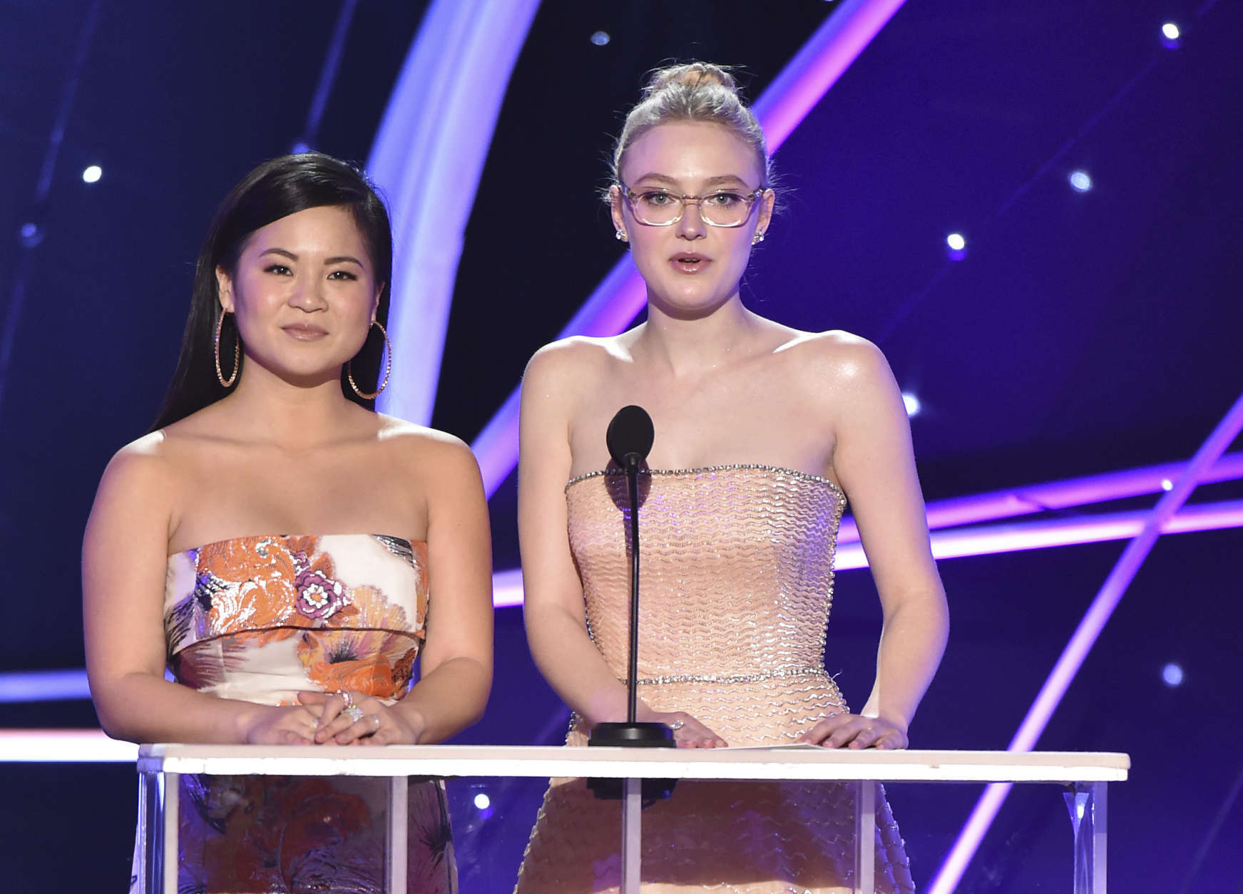 Kelly Marie Tran, left, and Dakota Fanning present the award for outstanding performance by a female actor in a drama series at the 24th annual Screen Actors Guild Awards at the Shrine Auditorium &amp; Expo Hall on Sunday, Jan. 21, 2018, in Los Angeles. (Photo by Vince Bucci/Invision/AP)