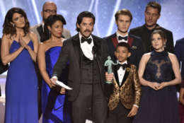 Milo Ventimiglia and the cast of "This Is Us" accept the award for outstanding performance by an ensemble in a drama series at the 24th annual Screen Actors Guild Awards at the Shrine Auditorium &amp; Expo Hall on Sunday, Jan. 21, 2018, in Los Angeles. (Photo by Vince Bucci/Invision/AP)