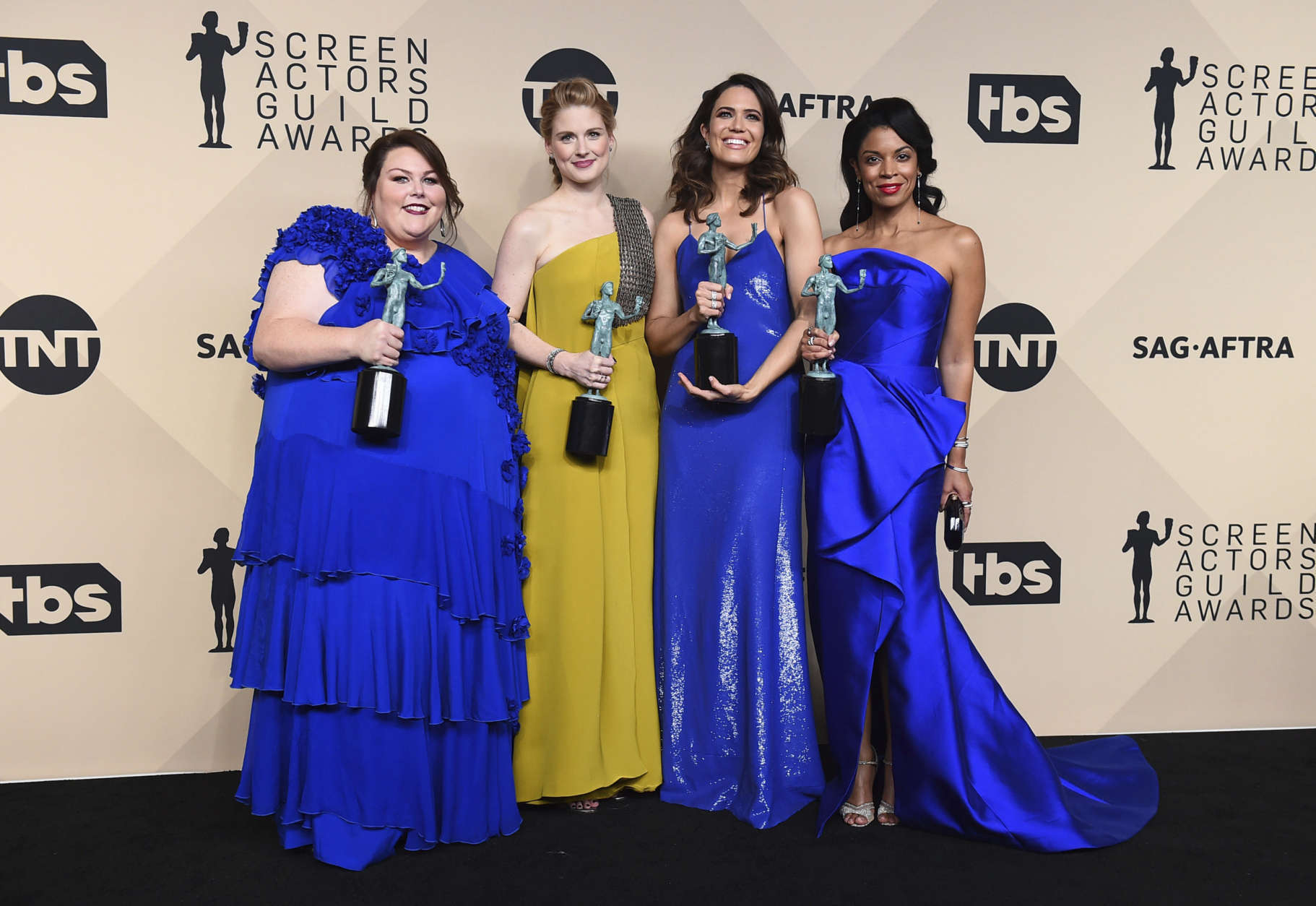 Chrissy Metz, from left, Alexandra Breckenridge, Mandy Moore, and Susan Kelechi Watson pose in the press room with their awards for outstanding performance by an ensemble in a drama series for "This Is Us" at the 24th annual Screen Actors Guild Awards at the Shrine Auditorium &amp; Expo Hall on Sunday, Jan. 21, 2018, in Los Angeles. (Photo by Jordan Strauss/Invision/AP)