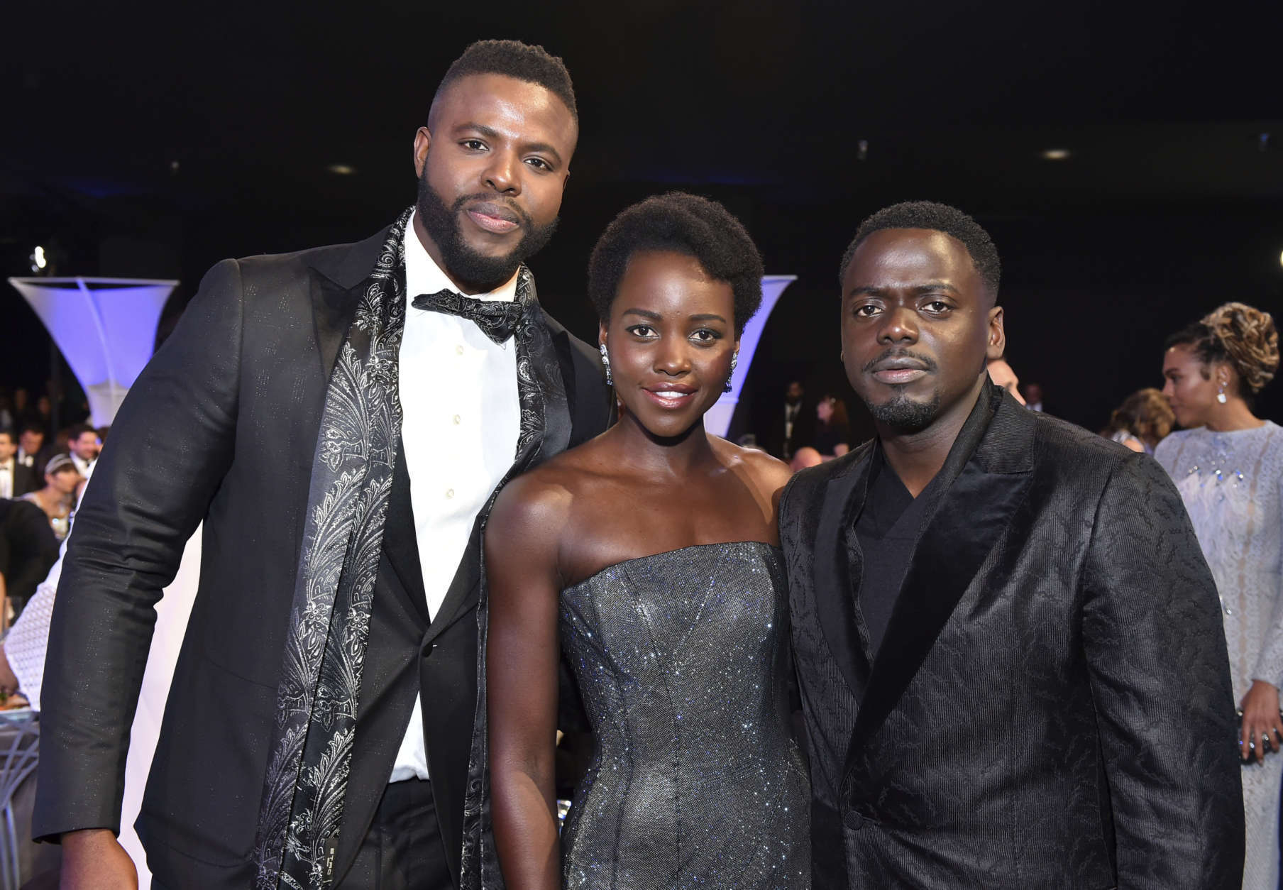 Winston Duke, from left, Lupita Nyong'o and Daniel Kaluuya pose in the audience at the 24th annual Screen Actors Guild Awards at the Shrine Auditorium &amp; Expo Hall on Sunday, Jan. 21, 2018, in Los Angeles. (Photo by Vince Bucci/Invision/AP)