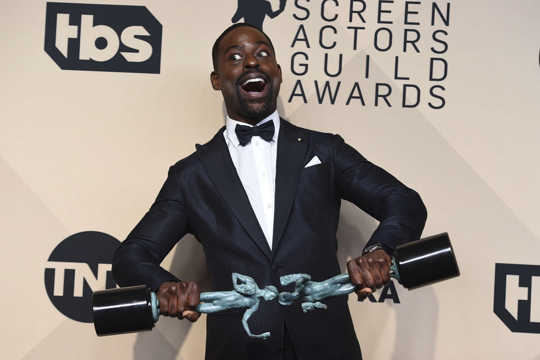 Sterling K. Brown, winner of the awards for outstanding performance by a male actor in a drama series for "This Is Us" and for outstanding performance by an ensemble in a drama series for "This Is Us", poses in the press room at the 24th annual Screen Actors Guild Awards at the Shrine Auditorium &amp; Expo Hall on Sunday, Jan. 21, 2018, in Los Angeles. (Photo by Jordan Strauss/Invision/AP)