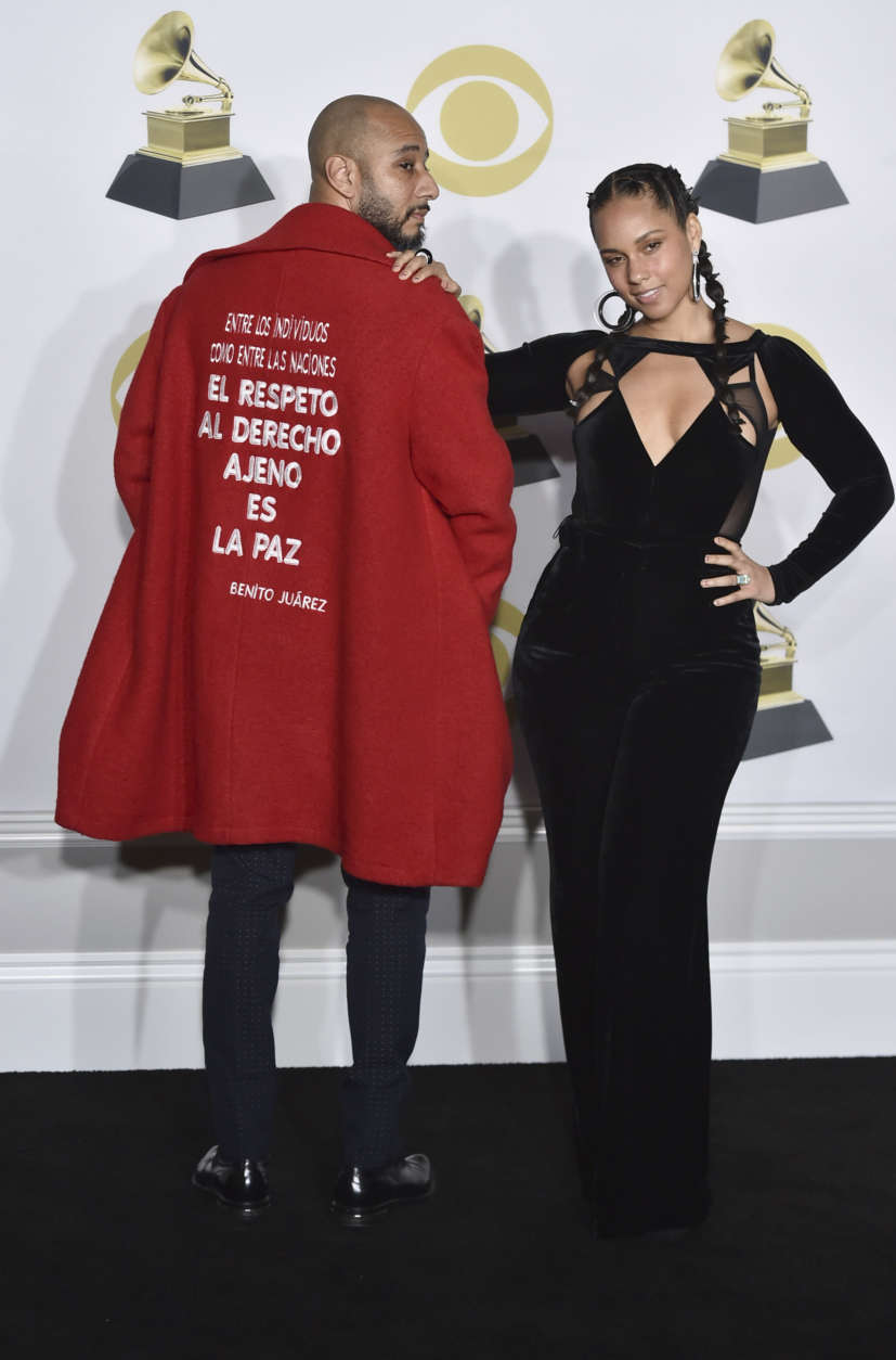 Swizz Beatz, left, and Alicia Keys pose in the press room at the 60th annual Grammy Awards at Madison Square Garden on Sunday, Jan. 28, 2018, in New York. (Photo by Charles Sykes/Invision/AP)