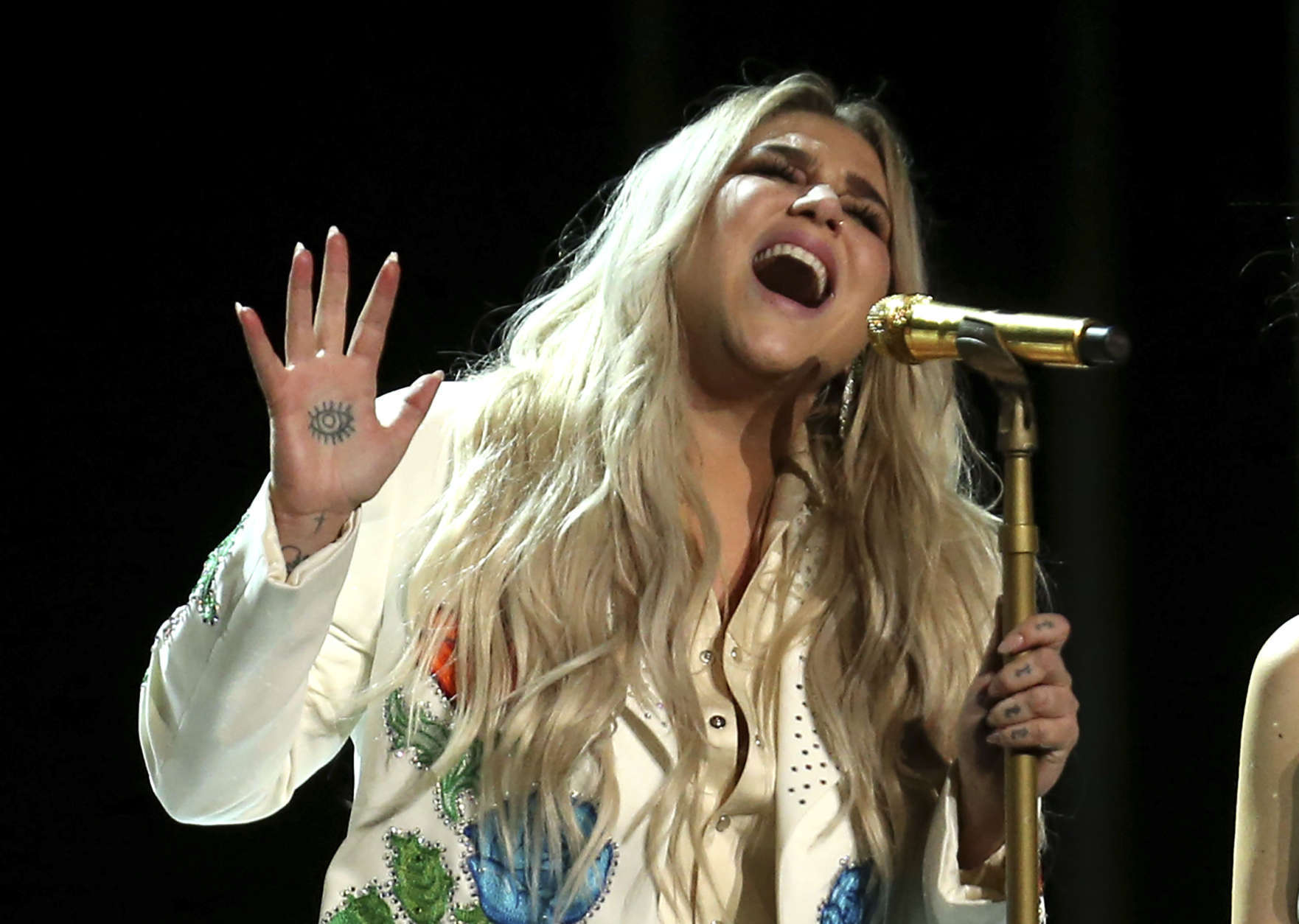 Kesha performs "Praying" at the 60th annual Grammy Awards at Madison Square Garden on Sunday, Jan. 28, 2018, in New York. (Photo by Matt Sayles/Invision/AP)