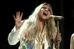 Kesha performs "Praying" at the 60th annual Grammy Awards at Madison Square Garden on Sunday, Jan. 28, 2018, in New York. (Photo by Matt Sayles/Invision/AP)
