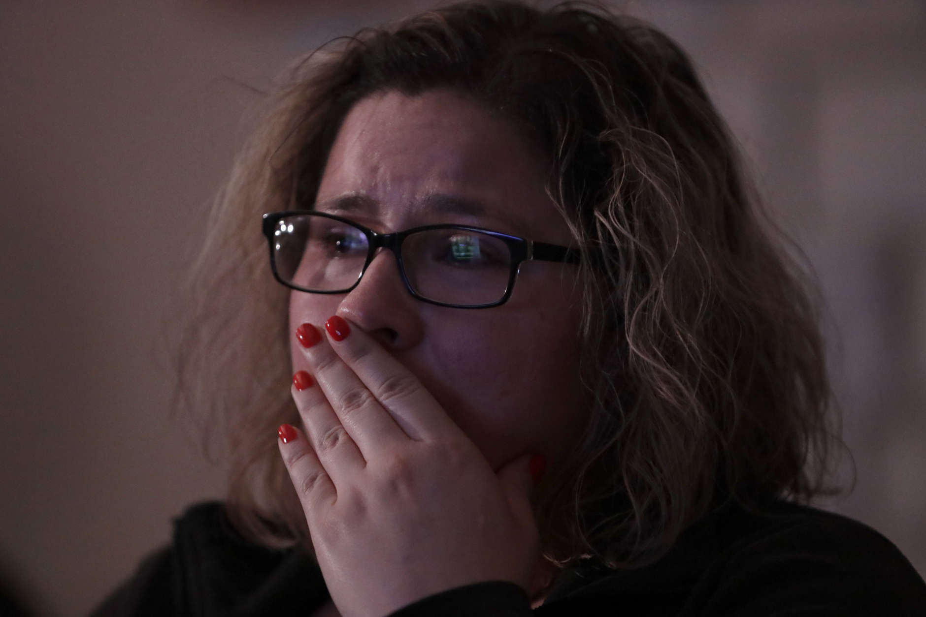 Angelica Magana, 34, a Deferred Action for Childhood Arrivals program recipient who was brought to the United State at the age of eight, reacts to President Donald Trump as he lays out is immigration policy during a State of the Union watch party Tuesday, Jan. 30, 2018, in Chicago. (AP Photo/Charles Rex Arbogast)