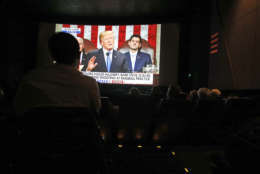 Republican supporters of President Donald Trump gather at a local movie theater to watch Trump deliver his State of The Union speech Tuesday, Jan. 30, 2018, in Peoria, Ariz. (AP Photo/Ross D. Franklin)