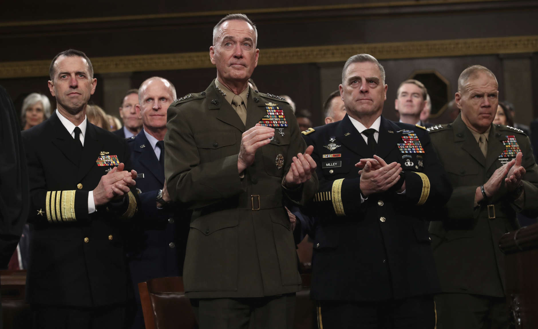 Chief of Naval Operations Adm. John Richardson, from left, Chairman of the Joint Chiefs of Staff Gen. Joseph Dunford, Chief of Staff of the Army Gen. Mark Milley, and Commandant of the Marine Corps Gen. Robert Neller listen as President Donald Trump delivers his first State of the Union address in the House chamber of the U.S. Capitol to a joint session of Congress Tuesday, Jan. 30, 2018 in Washington. (Win McNamee/Pool via AP)
