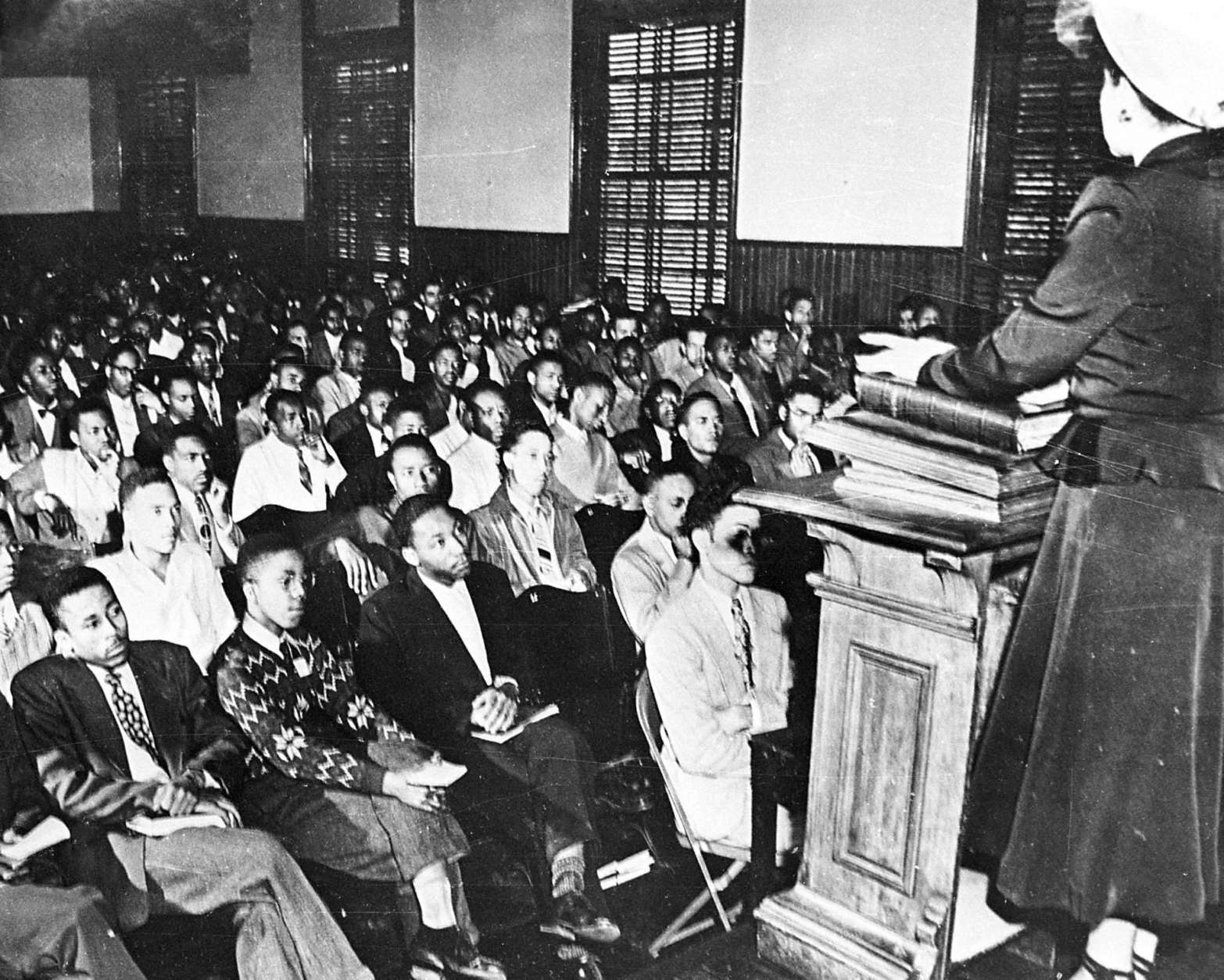Martin Luther King, third from left, listens to a speaker during an assembly at Morehouse College, in Atlanta, GA, in 1948. King subsequently graduated from the college with a Bachelor of Arts degree in Sociology. (AP Photo)