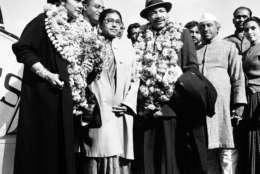 American civil rights leader Rev. Dr. Martin Luther King, Jr. and his wife Coretta, both wearing garlands, are received by admirers after landing at the airport in New Delhi, India, Feb. 10, 1959.  King, who is known here as the American Gandhi, flew here on what he calls a "four-week pilgrimage in India which to me means Mahatma Gandhi."  (AP Photo/R. Satakopan)