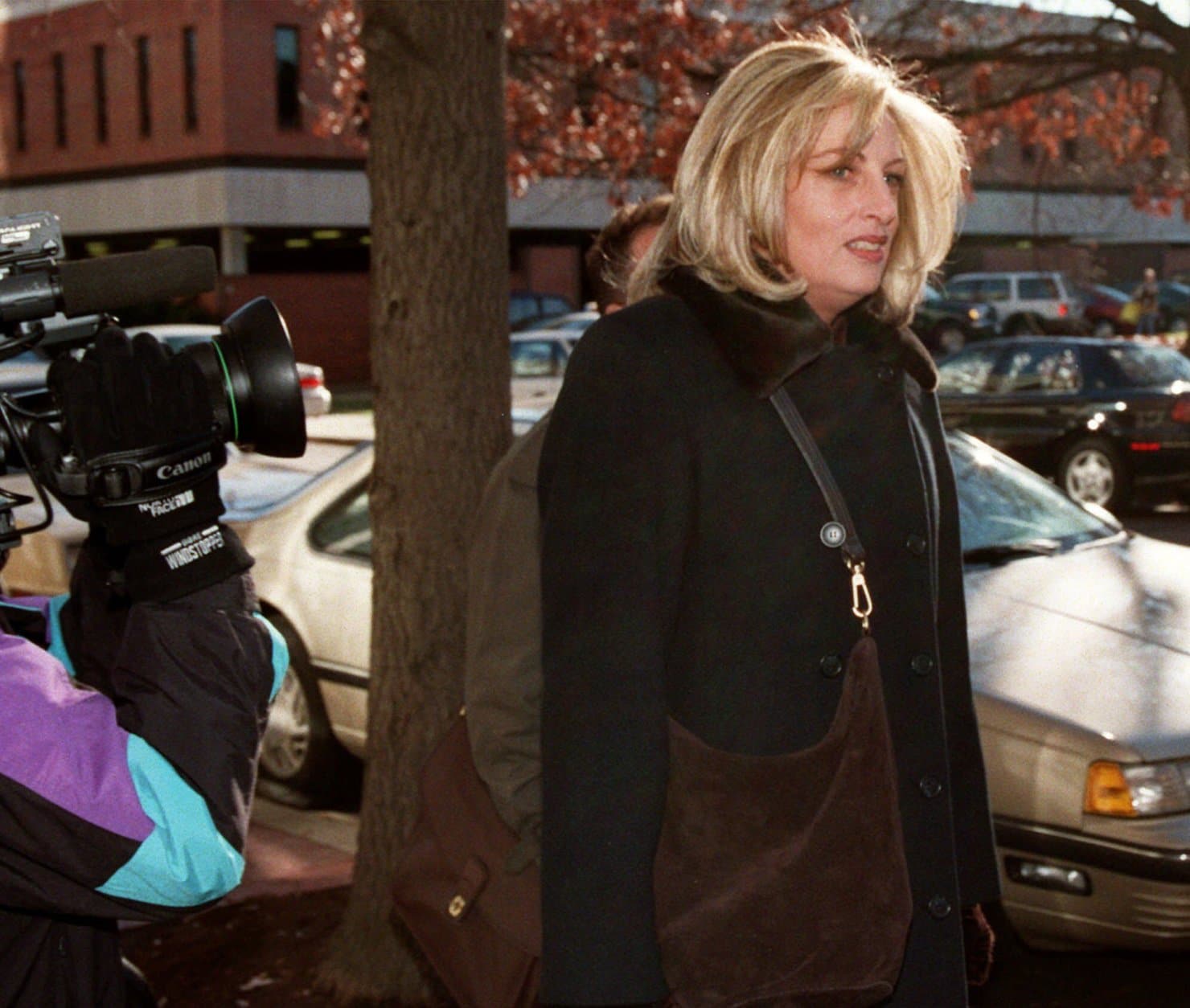 Linda Tripp arrives at the offices of Judicial Watch, a public interest law firm, in Washington Monday, Dec. 14, 1998 to give a deposition in a lawsuit about the FBI files controversy. Tripp, who formerally worked at the White House, and had her FBI security clearence released by the Pentagon to the news media, was to be questioned by Judicial Watch to determine whether the White House was behind the release of the information. (AP Photo/Dennis Cook)