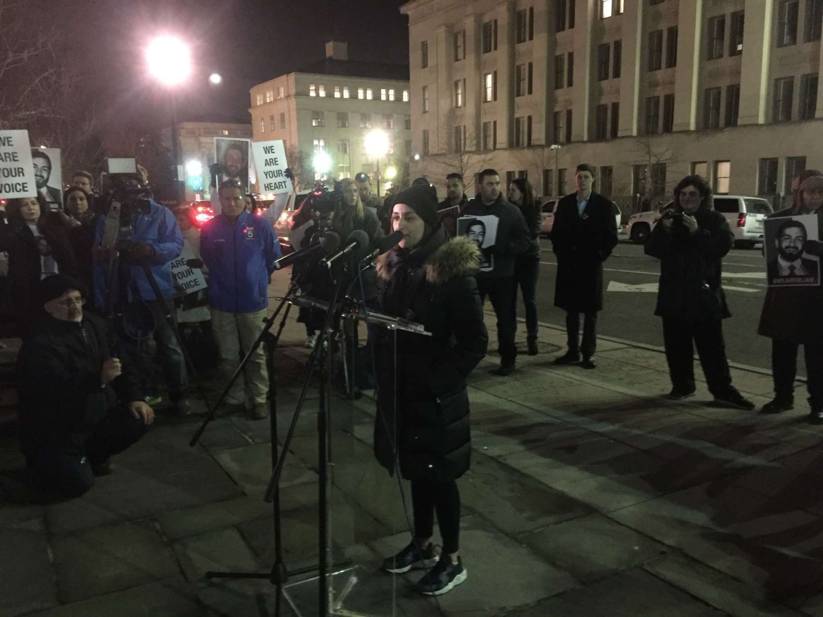 Negeen Ghaisar speaks at a rally held Friday, Jan. 26, 2018, outside of the Department of the Interior in D.C. Supporters demand answers in the U.S. Park Police shooting death of Virginia man Bijan Ghaisar last November. (WTOP/Mike Murillo)