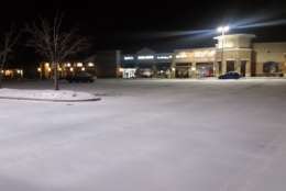 Shopping center off of Route 234 in Woodbridge. This area is only seeing a dusting so far but the wind is already picking up. (WTOP/Kathy Stewart)