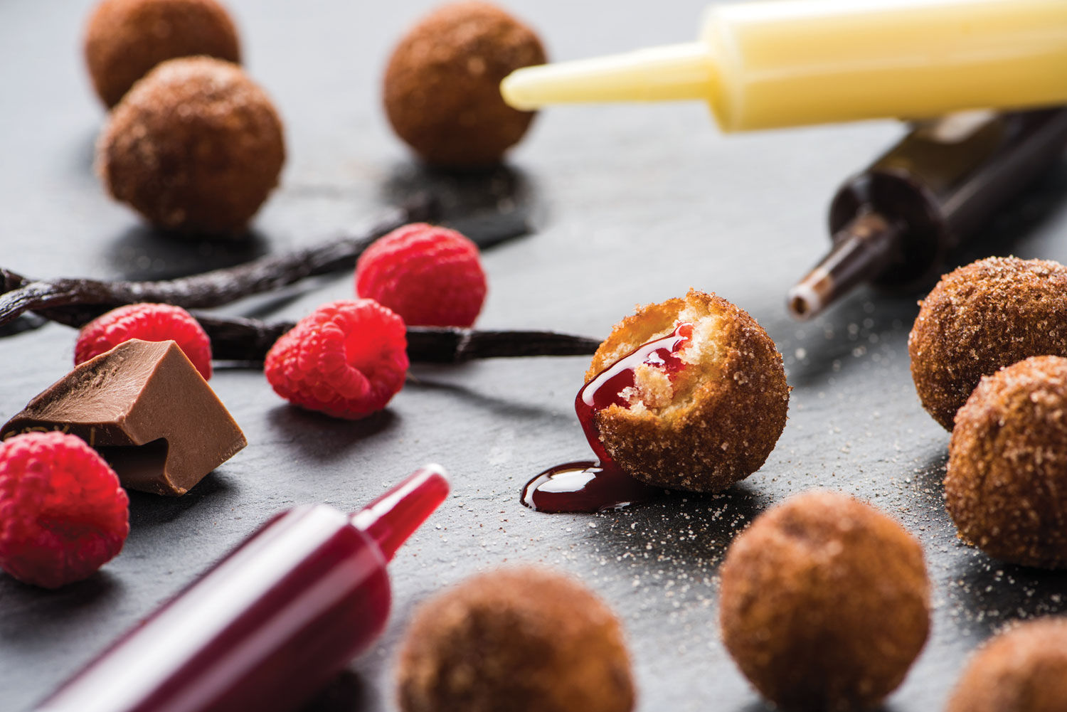 The Injectable Donut Holes include chocolate, raspberry and Bavarian cream fillings. (Courtesy: Topgolf)