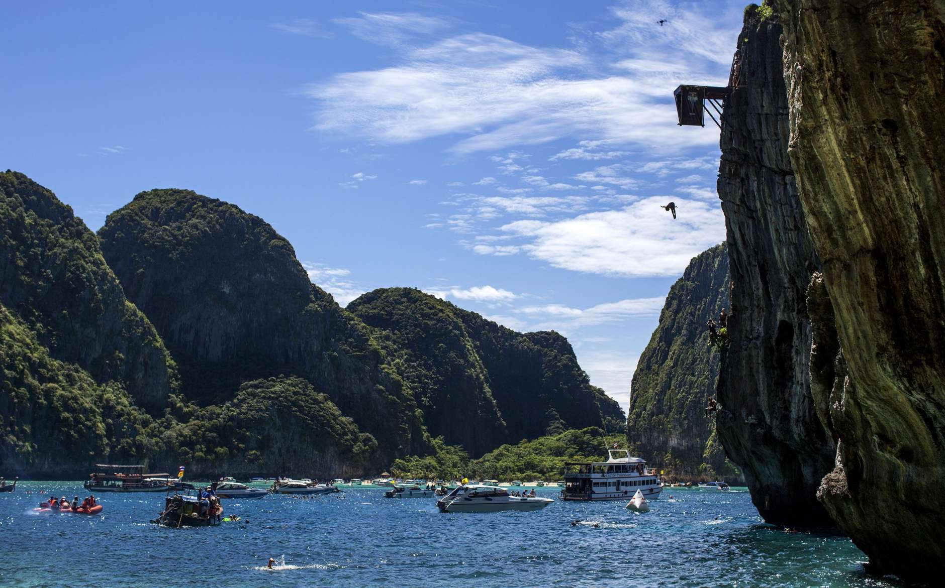 PHI PHI ISLAND, THAILAND - OCTOBER 22:  (EDITORIAL USE ONLY) In this handout image provided by Red Bull, Gary Hunt of the UK dives from the 27 metre platform at Maya Bay in the Andaman Sea during the final stop of the 2013 Red Bull Cliff Diving World Series on October 22, 2013 at Phi Phi Island, Thailand. (Photo by Romina Amato/Red Bull via Getty Images)