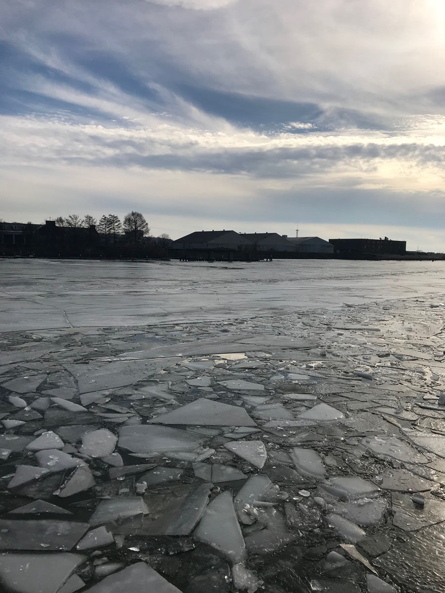 D.C. firefighters, specially trained by the U.S. Coast Guard, work to break up large ice sheets that formed in frigid temperatures blocking access on the waterway in an emergency.
 (WTOP/Megan Cloherty)