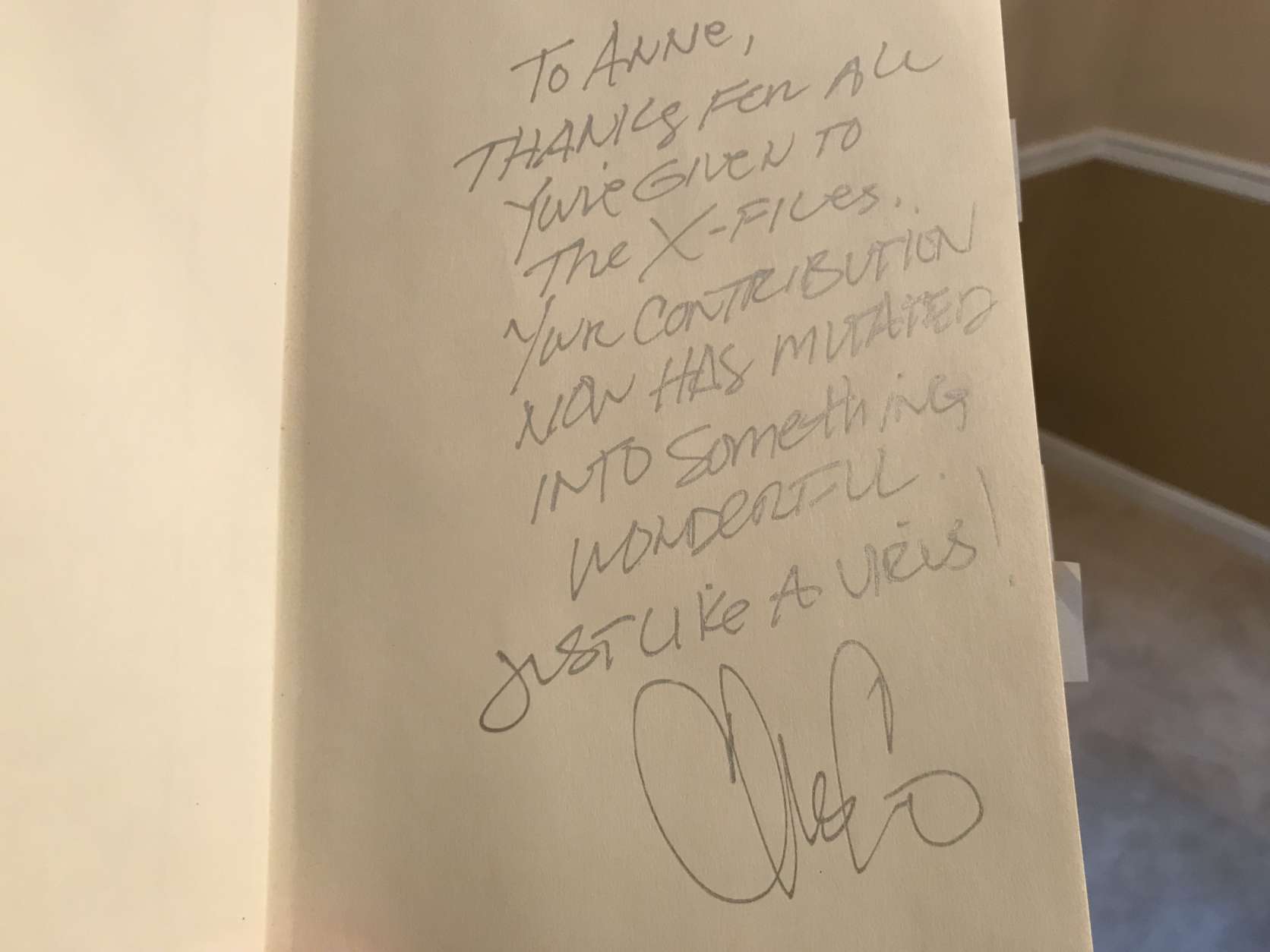 “The X-Files” creator Chris Carter signed Anne Simon’s book. Simon,
 a virologist from the University of Maryland,
 is an adviser in the series.
 (WTOP/Michelle Basch)