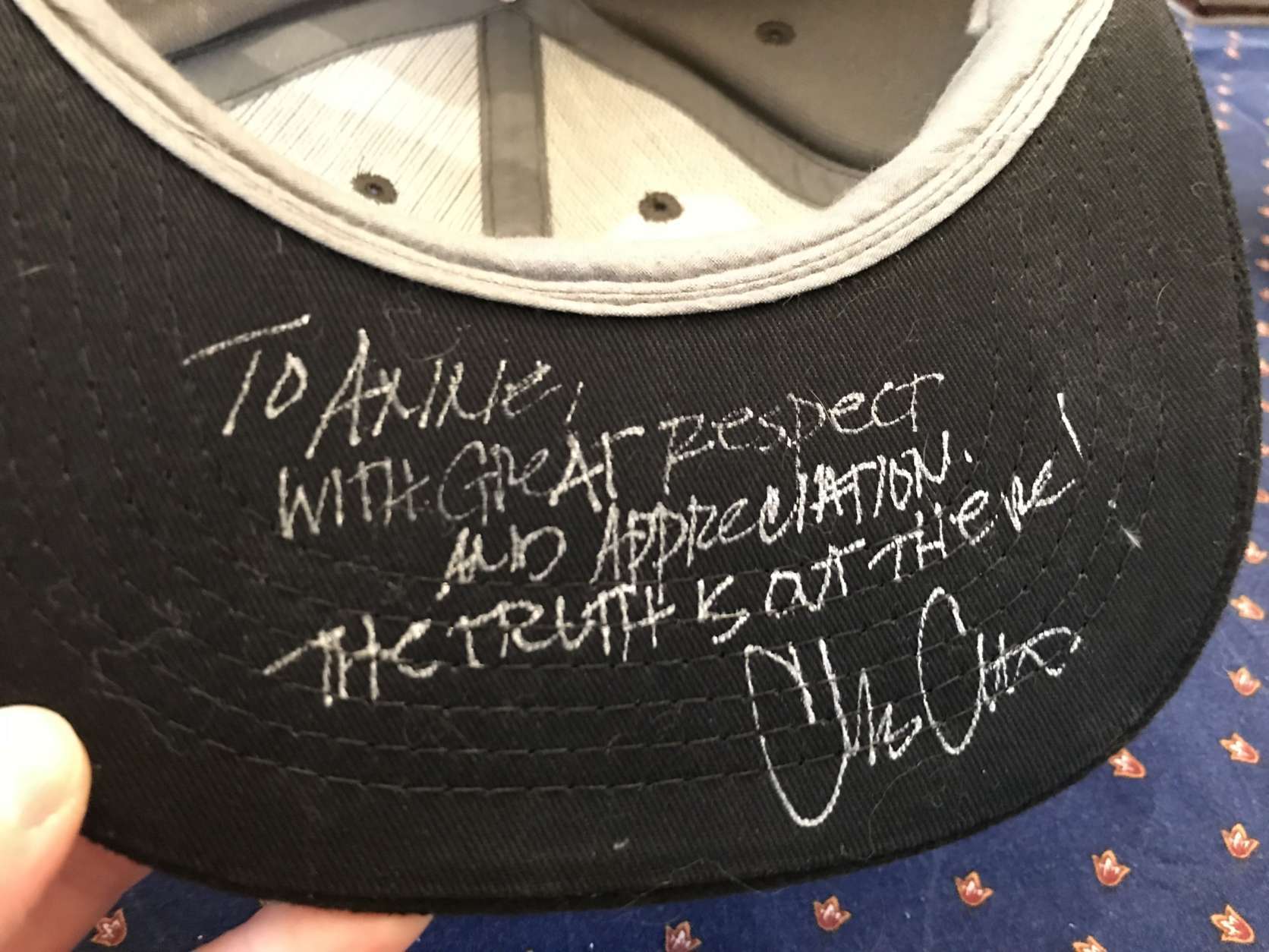 Chris Carter, the creator of “The X-Files,” also signed a hat for Anne Simon. 
(WTOP/Michelle Basch)