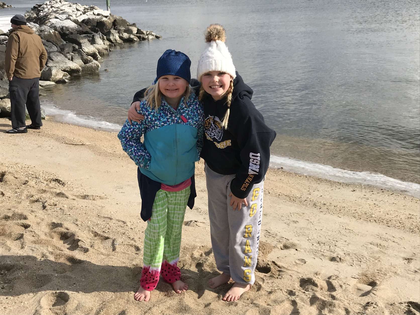 These girls exposed their bare feet to the chilly air well before plunge time. (WTOP/Michelle Basch)