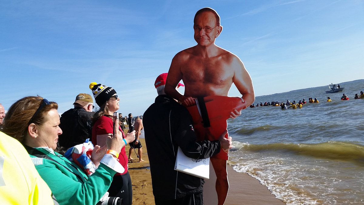 The beach, as opposed to the water, was certainly a much warmer place to view the event. Those who took part said doing it for a good cause helped warm their hearts. (WTOP/Kathy Stewart)