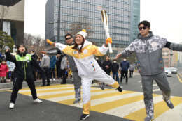 Lee poses during the Olympic torch relay in Seoul, South Korea. (WTOP/Suann Lee)