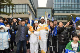 Suann Lee poses at the end of the Olympic torch relay. (WTOP/Suann Lee)