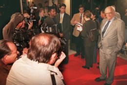Playwrite Arthur Miller, right, poses for photographers as he arrives for the premiere of the "The Crucible," in Beverly Hills, Calif., Wednesday, Nov 20, 1996.  "The Crucible," which is based on one of Millers plays, is stars Daniel Day-Lewis and Winona Ryder, and produced by Millers son Robert A. Miller.(AP Photo/ Frank Wiese)