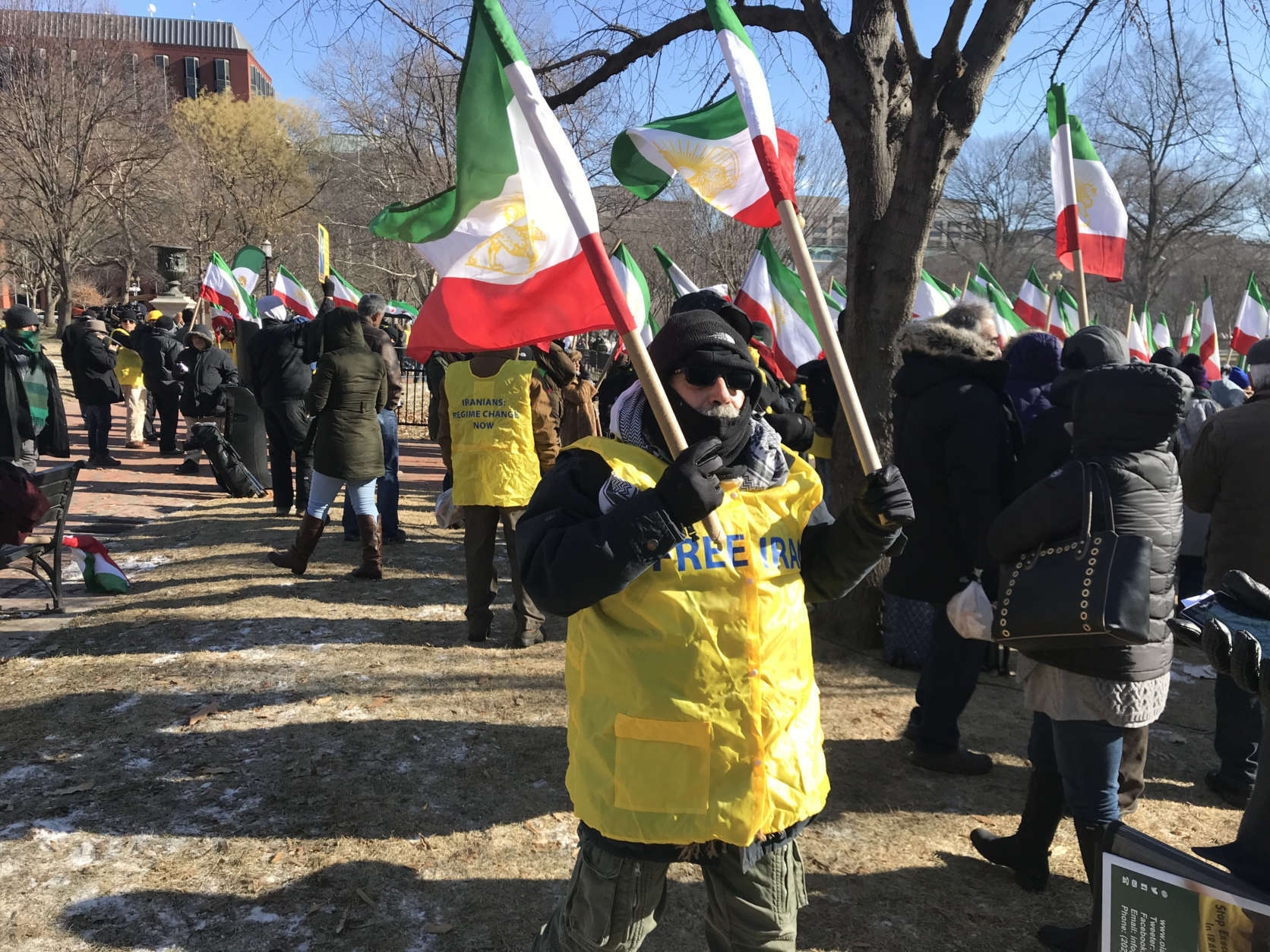 The demonstrators waved flags including the flag of the Shah, or king, who was overthrown by Iran's current regime. (WTOP/Dick Uliano) 