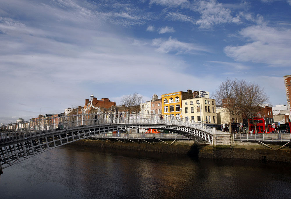 Ha'Penny Bridge is shown on the river Liffey in Dublin, Ireland on Monday, Feb. 16, 2009.  (AP Photo/Peter Morrison)